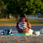 Person meditating outdoors at dawn in Cove Island Park, Stamford, Connecticut.